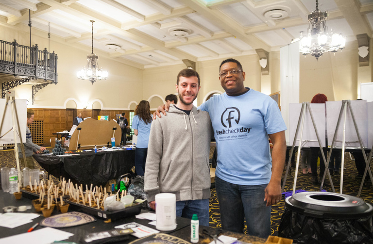 two students standing together at mental health fair