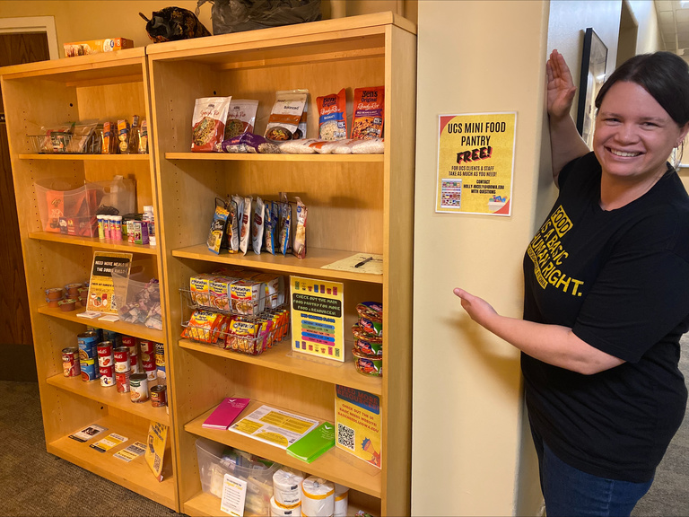 Dr. Nicely with the mini food pantry at Westlawn UCS office